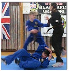 Woman defending against two attackers